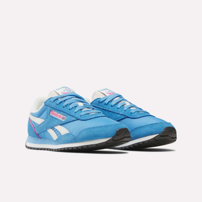 A pair of Women's Classic AZ Shoes by Reebok in blue, featuring white soles, white and pink accents, and the Reebok logo on the sides, displayed against a plain white background.