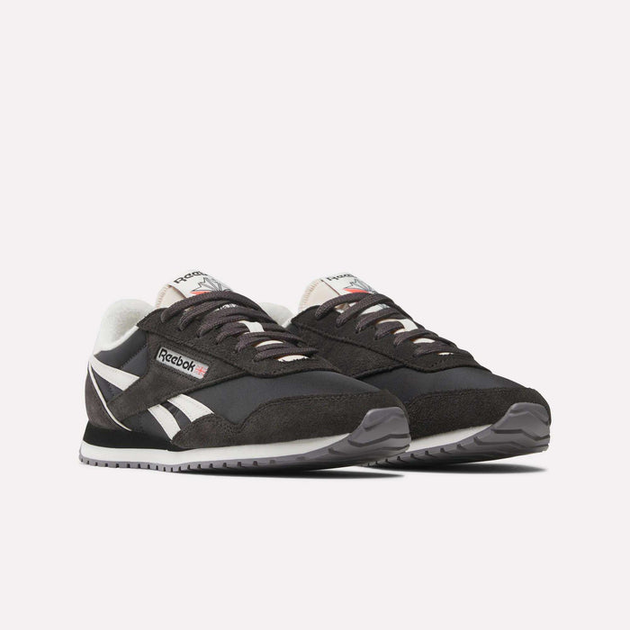 A pair of Women's Classic AZ Shoes by Reebok in black with white accents and gray outsoles, displayed side by side on a plain white background—ideal for retro running shoe enthusiasts.