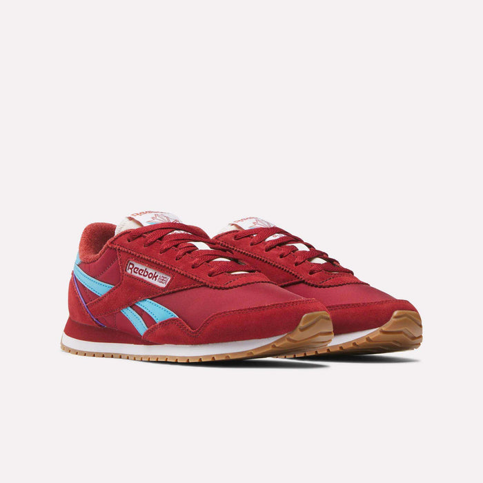 The Women's Classic AZ Shoes by Reebok, in red with light blue side stripes, white midsoles and tongue labels, and brown outsoles, are shown on a plain white background.