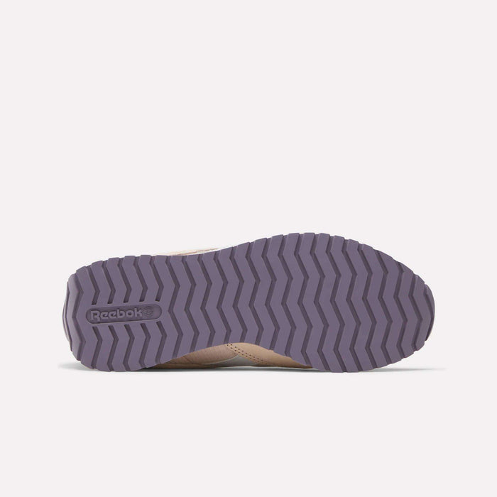 The image shows the sole of a Women's Classic AZ Shoe by Reebok, featuring a purple zigzag tread pattern and the Reebok logo on the left, echoing a retro running shoe vibe. The rest of the shoe is only partially visible.
