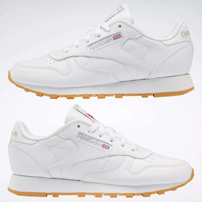 Two views of the Reebok Women's Classic Leather Shoes, featuring a cushioned midsole, gum soles, white laces, and the Reebok logo with a UK flag. This low-top design is ideal for those seeking stylish women’s leather sneakers.