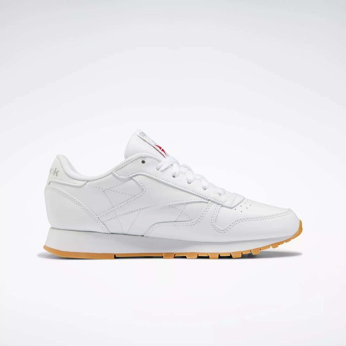 The Reebok Women's Classic Leather Shoes feature a cushioned midsole, gum sole, and subtle branding, shown in a left-side profile against a plain light background.