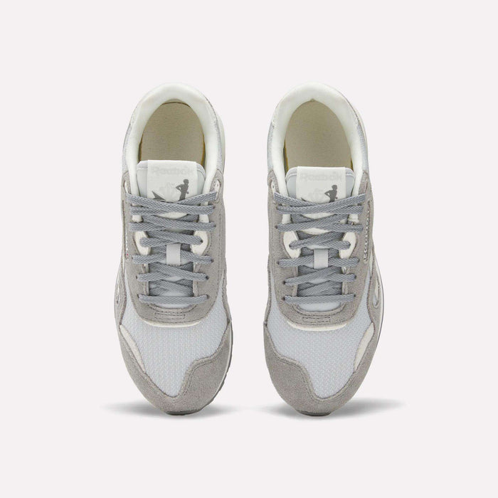 The Reebok Women's Classic Nylon 89 Shoes, shown in gray and white with white laces on a plain background, feature a retro design ideal for women's running.