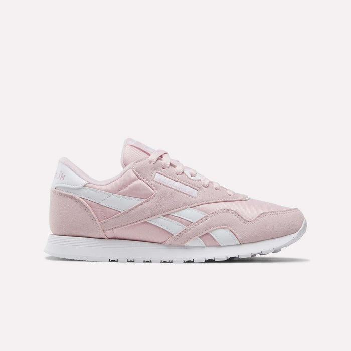Showcased on a plain white background, the Reebok Women's Classic Nylon Shoes come in Elemental Pink with white accents and laces, featuring the iconic retro design and a white rubber sole—an ideal addition to any women's shoe collection.