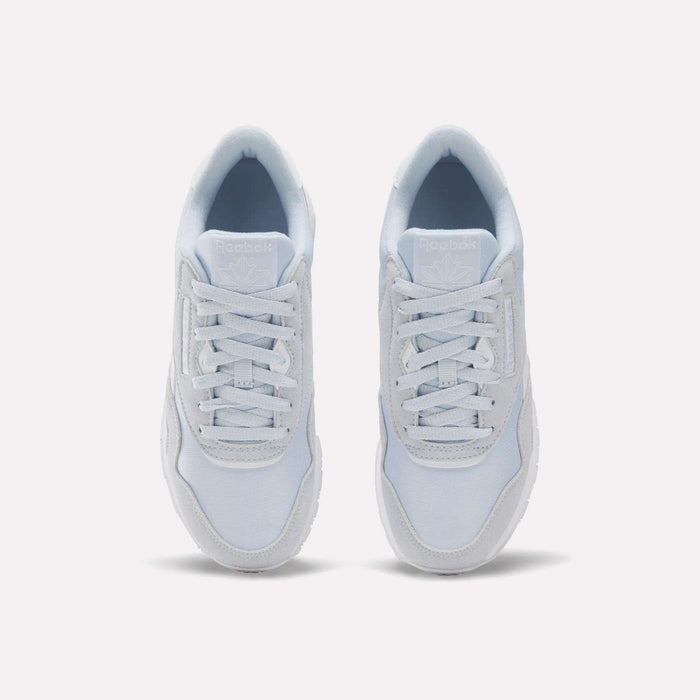 A pair of Reebok Women's Classic Nylon Shoes in white are shown from a top-down view with the laces neatly tied, set against a plain white background.
