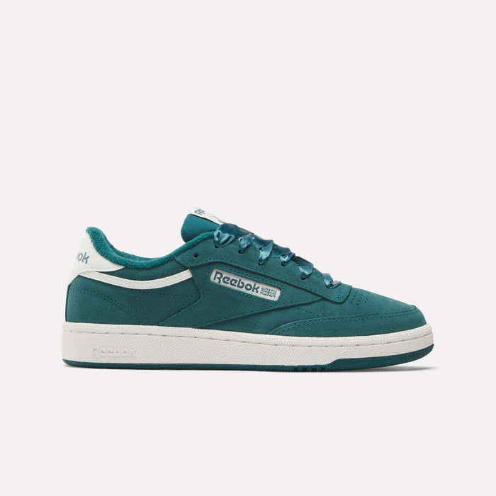 The Women's Club C 85 Shoes by Reebok in teal with white accents feature the Reebok logo on the side and a white sole, shown against a plain white background.