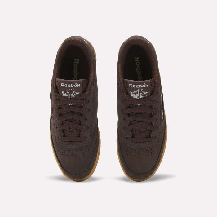 Top view of Women's Club C 85 Shoes by Reebok in dark brown leather with gum soles, white Reebok logos on the tongues, and black laces, shown against a plain light background.