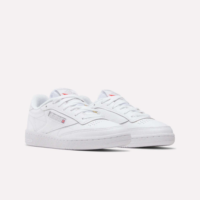 Reebok Women's Club C 85 Shoes are low-top white sneakers with laces and subtle Reebok logos on the side and tongue, displayed on a plain white background—ideal for a clean, classic look.