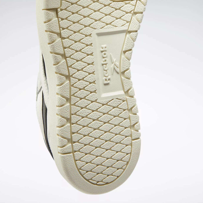 Close-up of the textured sole on Reebok Women's Club C Double Revenge Shoes, showcasing the embossed Reebok name and logo at the center with a hexagonal tread—ideal for fans of court-inspired styles.