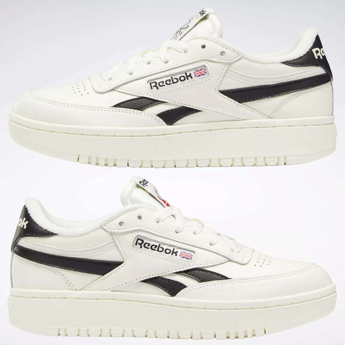 Two pairs of Women's Club C Double Revenge Shoes by Reebok in white with black accents and the Reebok logo on the side, featuring a double outsole, are shown from a side view against a plain light background.