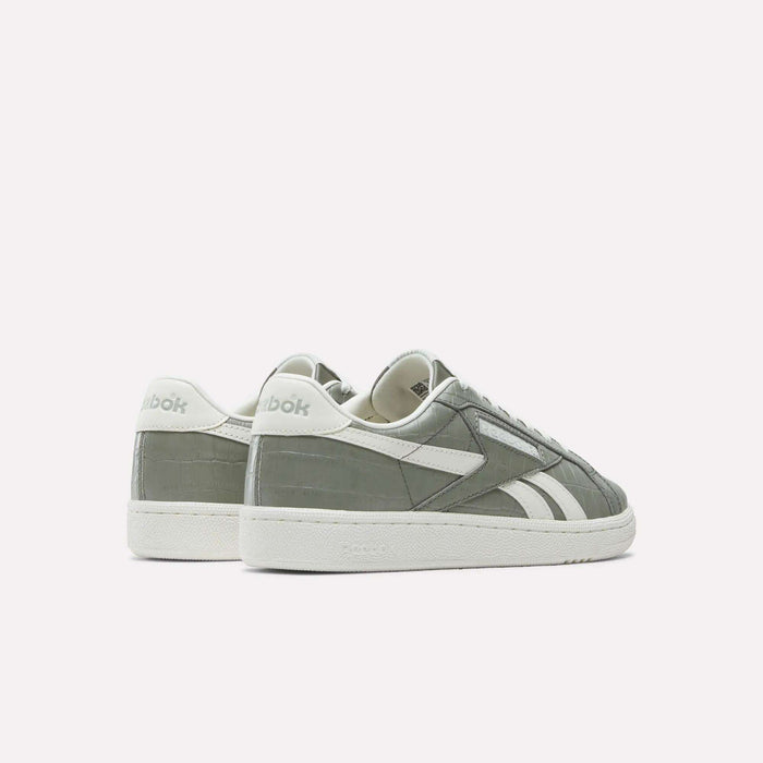 A pair of Reebok Women's Club C Grounds UK Shoes in gray and white premium leather, featuring the brand logo on the heel and side, displayed on a white background with one shoe slightly behind the other.