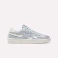 A pair of Women's Club C Revenge Shoes by Reebok in the Breeze/Chalk/Breeze colorway, featuring a classic side profile with vintage court-inspired style, white sole, subtle light blue accents, and a white Reebok logo, is presented against a plain white background.