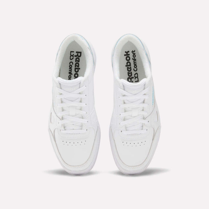 A pair of white Reebok Women’s Court LXS Shoes viewed from above, featuring white laces, perforated toe boxes, and Reebok LD Comfort printed on the insoles. Crafted from premium full grain leather, these women’s court shoes blend timeless style with lasting comfort.