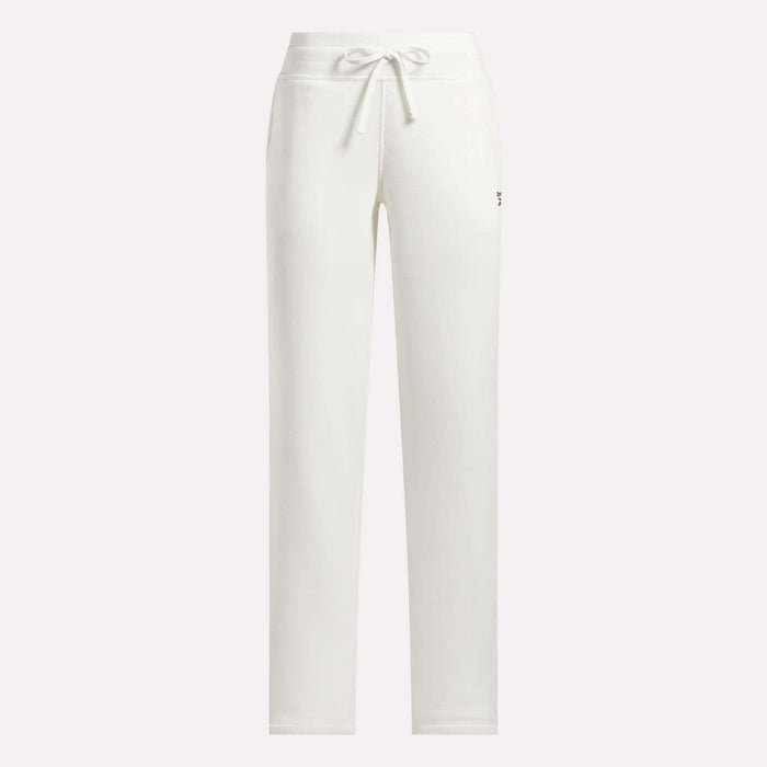 Reebok Women's Cozy Classic Sweatpants in white cotton blend featuring a drawstring waistband, straight-leg fit, and a small logo on the upper left thigh. Shown against a plain, light-colored background.