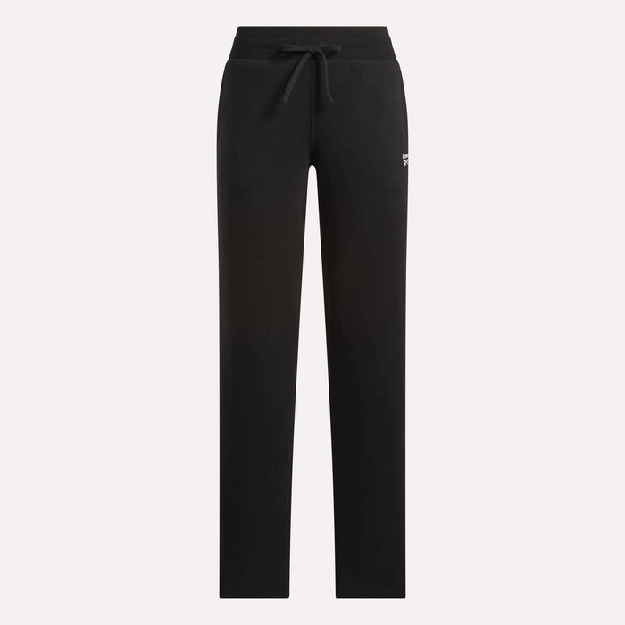 The Reebok Women's Cozy Classic Sweatpants feature a black cotton-blend fabric, straight legs, drawstring waistband, and small white logo on the upper left thigh, shown against a plain light background.