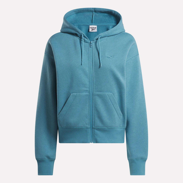 Reebok Women's Cropped Full-Zip Hoodie in blue, made with cozy knit fabric. Features a zip-up front, drawstring hood, front pockets, and a small chest logo. Displayed on a plain white background.