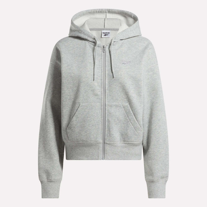 The Reebok Women's Cropped Full-Zip Hoodie in light gray features a zip-up front, hood with drawstrings, front pockets, and ribbed cuffs and hem, shown against a plain white background.