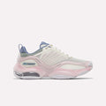 Step out in style and comfort with the Reebok Women's DMX Series 3000 Training Shoes, featuring a breathable white mesh upper highlighted by elemental pink and legacy green accents, plus a chunky sole with transparent heel sections. These standout sneakers incorporate advanced DMX 3 Technology for a responsive stride—perfect for those seeking cushioned shoes that combine eye-catching design with lasting comfort.