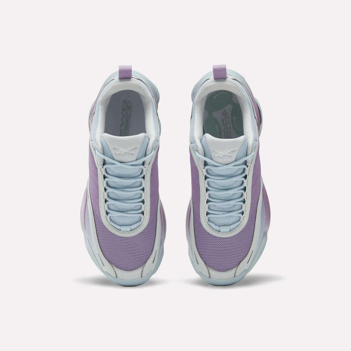 Top view of Reebok Women's DMX Series 3000 Training Shoes with light purple mesh uppers, white soles, and pale blue laces, featuring DMX 3 Technology for cushioned comfort—all side by side on a plain white background.