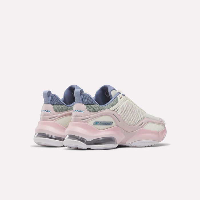 A pair of pastel-colored sneakers—the Women's DMX Series 3000 Training Shoes by Reebok—featuring pink soles, white mesh uppers, lilac accents, and advanced DMX 3 Technology for enhanced comfort, displayed against a plain white background.