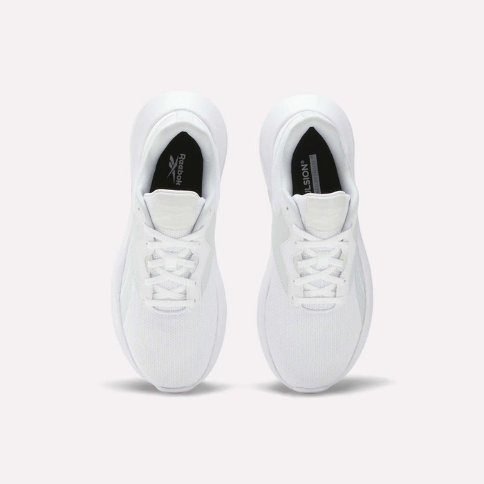 A pair of Reebok Women's Energen Lux Running Shoes viewed from above displays laces, mesh toe texture, and black Reebok logos on the inner soles. These lightweight shoes are side by side on a plain light background.