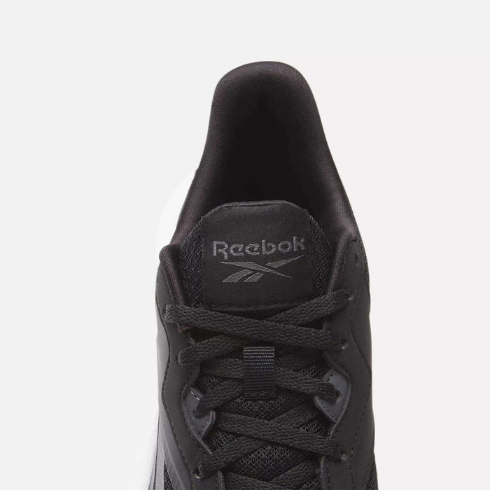 Top view of a black Women's Energen Lux Running Shoe by Reebok with black laces, mesh fabric, and a gray Reebok logo on the tongue. Set against a plain white background.