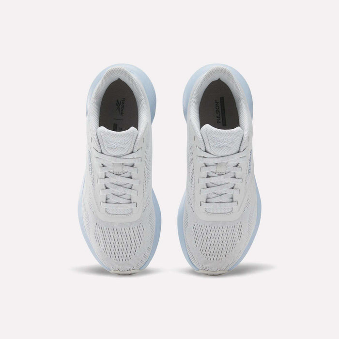 Top view of Reebok Women's Energen Run 4 Running Shoes featuring breathable mesh uppers and laces, placed side by side on a light background.