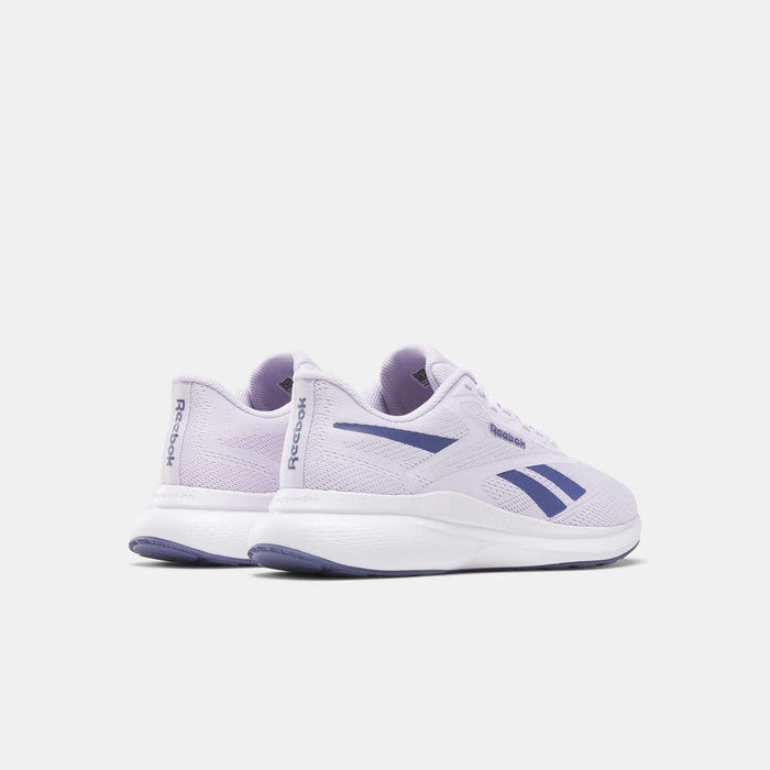 The Reebok Women's Energen Run 4 Running Shoes in light purple feature a breathable mesh upper and dark purple logo details, shown angled to display both the side and back on a plain light background.