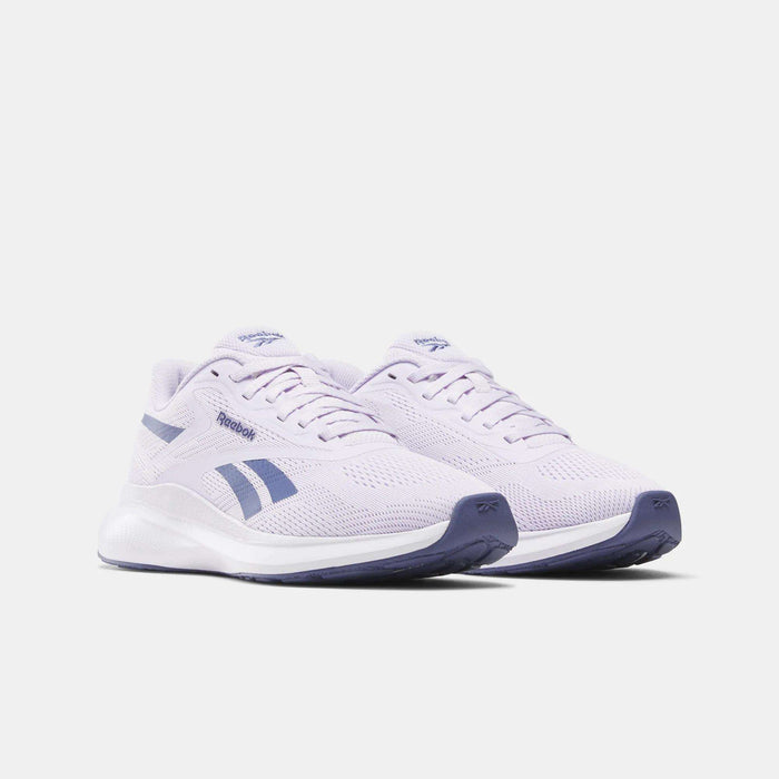 The Reebok Women's Energen Run 4 Running Shoes feature a breathable mesh upper, light purple color with dark purple accents and soles, shown on a white background.