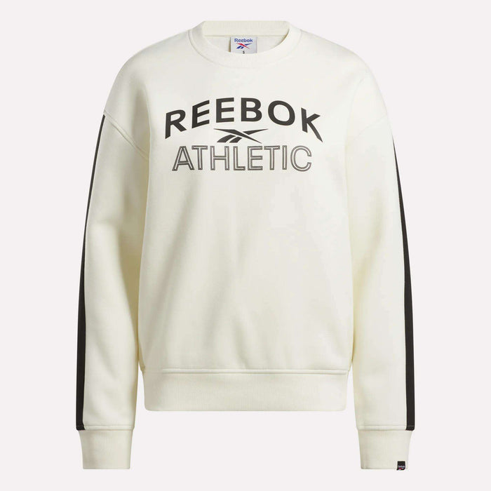 The Reebok Women's Fleece Crew Sweatshirt features black REEBOK ATHLETIC text and logo on the front, black stripes down both sleeves, and is made from soft brushback fleece for a cozy feel. Color: white.