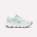 The Reebok Women's FloatZig 2 Running Shoes in White/Grey/White feature Superfloat+ cushioning, a segmented sole, and black outsole, shown in side profile on a plain white background.