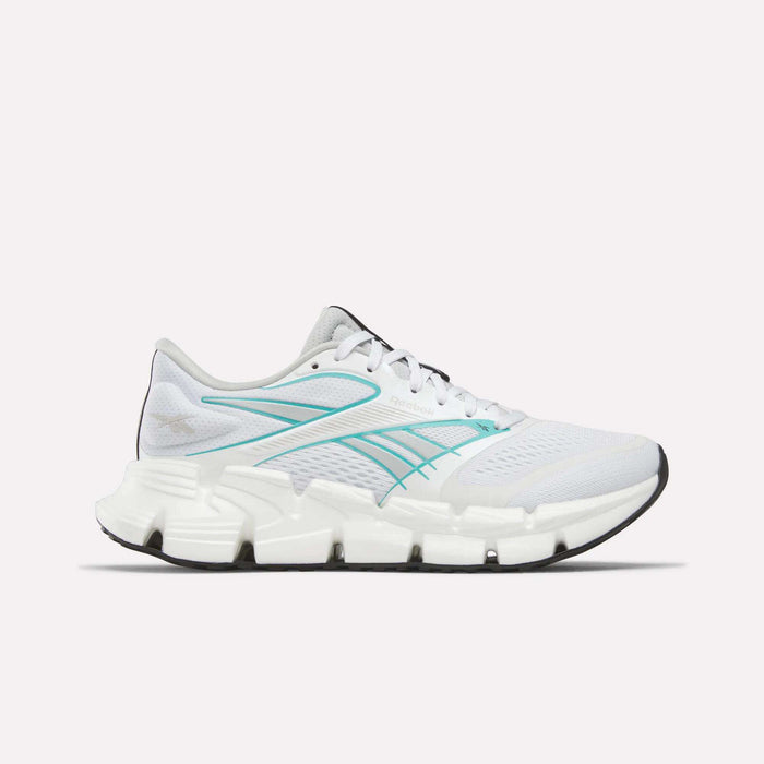 The Reebok Women's FloatZig 2 Running Shoes in White/Grey/White feature Superfloat+ cushioning, a segmented sole, and black outsole, shown in side profile on a plain white background.