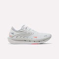Reebok Women's FloatZig Tread Running Shoes in Ftwr White/Tranquil Blue/Neon Cherry feature a breathable mesh upper, lace-up design, logo detail, and cushioned sole—ideal for treadmill workouts.