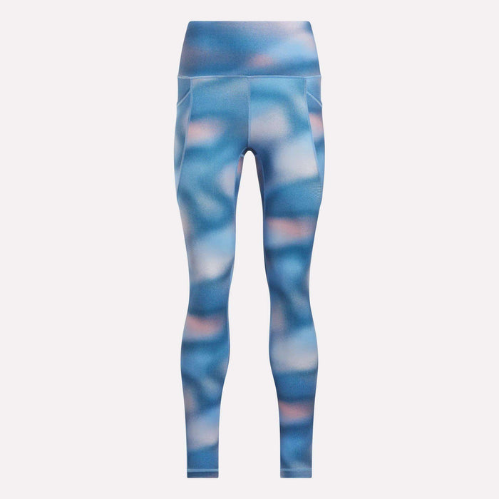 The Reebok Women’s Fluid Print High-Rise Tights feature a blue and pink abstract pattern, side pockets, moisture-wicking fabric, and a smooth, fitted silhouette—all shown against a plain white background.