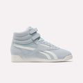 Reebok Women's F/S Hi Shoes in light blue feature a suede upper, two Velcro straps, white side stripes, perforated accents, and an off-white sole, shown against a plain white background.