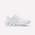 The Reebok Women's Fuel Flex Run Shoes feature a white mesh upper, Fuel Flex midsole with oval cutouts, and white laces for style and comfort. Photographed on a plain light background.