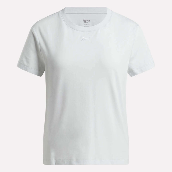 The Women's Graphic Glow Top by Reebok is shown against a light background, featuring a soft feel, classic crew neck, and subtle chest logo for timeless comfort and style.
