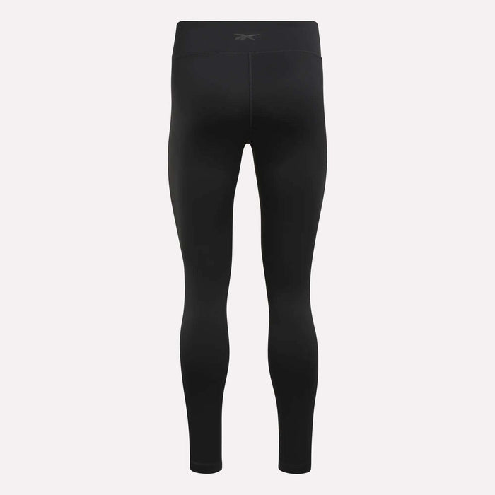 Reebok Women’s Lux High-Rise Tights shown from the back, featuring a high waistband, subtle seam details, and RBK-DRY performance fabric—all on a simple light background.