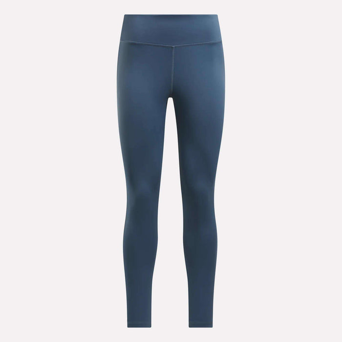 The Women's Lux High-Rise Tights by Reebok are full-length, dark blue athletic leggings made with RBK-DRY performance fabric, shown against a plain light background.