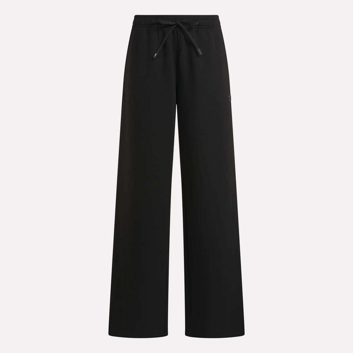 Women’s Mid-Rise Wide-Leg Pants by Reebok in black, featuring an elastic waistband with drawstring and a relaxed fit, showcased against a plain light background—ideal for everyday comfort and effortless style.