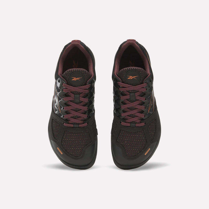A pair of Reebok Women’s Nano 2.0 Training Shoes in black with maroon accents and laces, displayed from an overhead perspective to highlight the tops and tongues of both shoes against a white background—perfect for functional fitness routines.