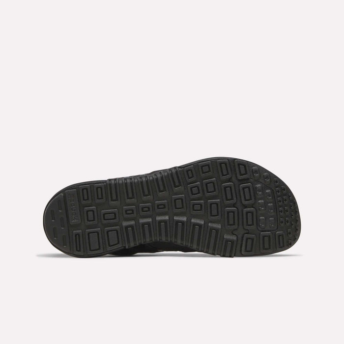 The image displays the black rubber sole of the Reebok Women’s Nano 2.0 Training Shoes, showcasing a geometric tread pattern with rectangular and square shapes for improved grip—ideal for functional fitness and fans of Reebok training footwear.