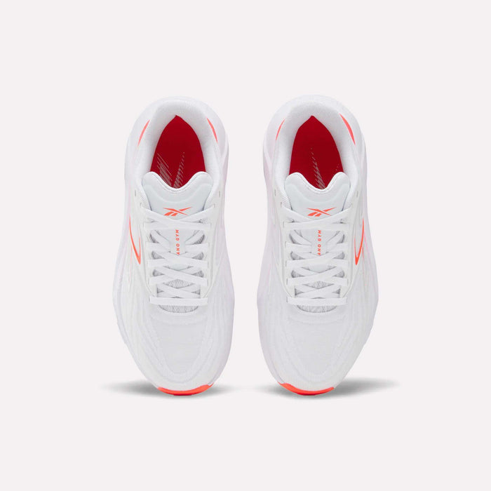 Top view of Women's Nano Gym 2.0 Reebok training shoes in white with red side and interior accents, white laces, and a subtle Reebok logo on the tongue.