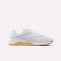 The Reebok Women's Nano X4 Training Shoes feature a breathable mesh upper, white laces, and a light brown gum sole with Floatride Energy Foam for responsive cushioning. Displayed on a plain white background.