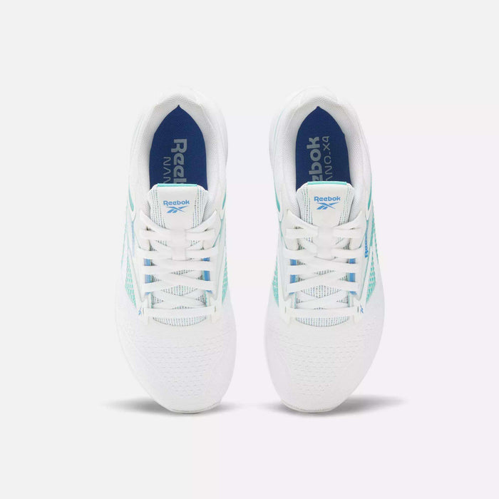 A pair of Women's Nano X4 Training Shoes by Reebok in white with blue and teal accents, shown from above. Features include laces, breathable mesh uppers, and blue insoles with Reebok branding on a light grey background.