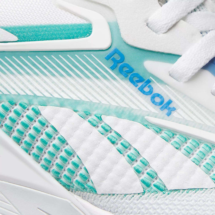 Close-up of Reebok Women's Nano X4 Training Shoes with the blue logo, white laces, and a textured design in white and teal with geometric patterns—lightweight and perfect for your workouts.
