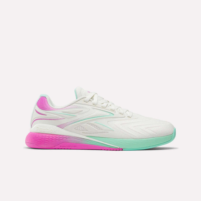 The Women's Reebok Nano X5 Edge Training Shoes feature a white athletic design with light teal accents, a mint green sole at the front, and pink details on the heel and outsole—ideal for your next HIIT class.