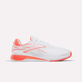 The Women's Nano X5 Edge Training Shoes by Reebok are white athletic shoes with coral accents on the heel, sole, and logo—ideal for HIIT—displayed against a plain white background.