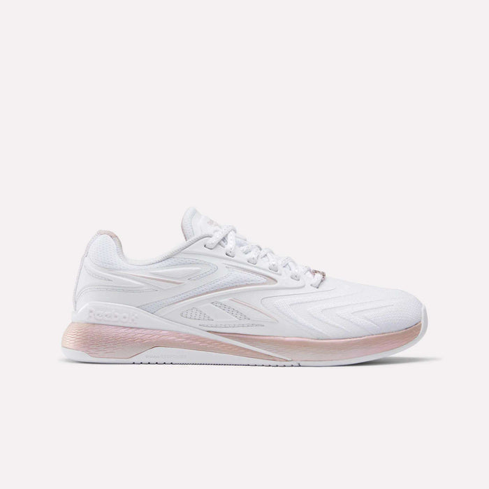 The Reebok Women's Nano X5 Edge Training Shoes feature a white color with pink accents on the sole and heel, a woven texture side design, and the Reebok logo—ideal for versatile workouts.