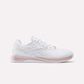 The Reebok Women's Nano X5 Edge Training Shoes feature a white color with pink accents on the sole and heel, a woven texture side design, and the Reebok logo—ideal for versatile workouts.